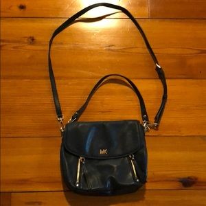 Michael Kors purse black the purse is 10” Wide and 8 “ length